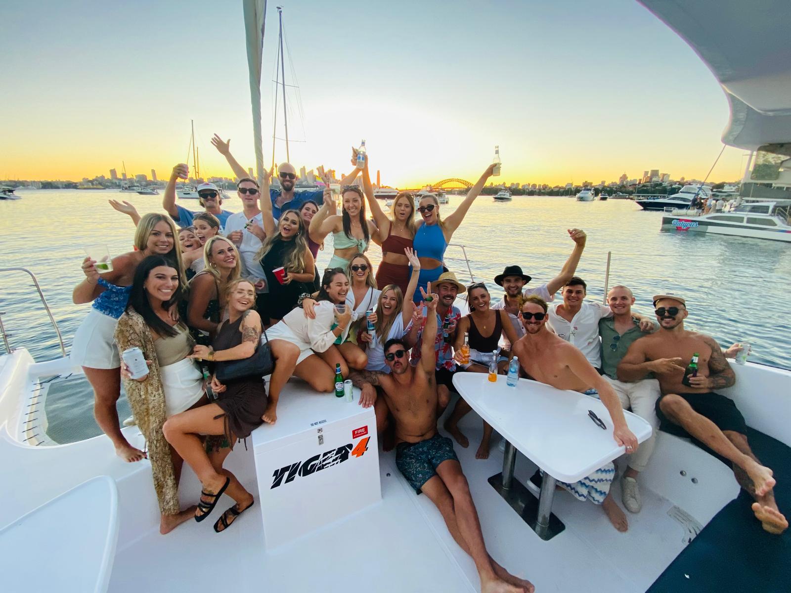 Guests celebrating on a private Tiger 4 charter on Sydney Harbour